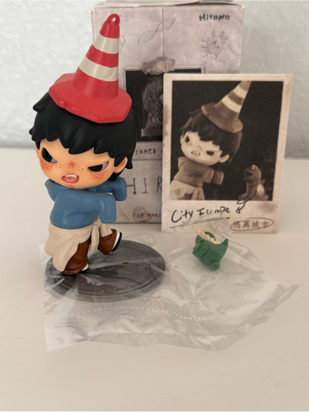 City Escape Girl Figure in Blue Hoodie with Red Party Hat